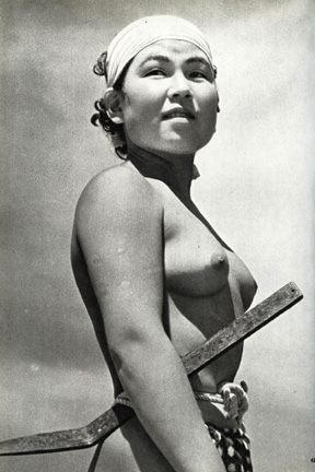 Topless Mongolian fisherwoman with spear and rope knotted at the waiste.