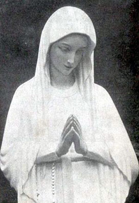 White mystical statue of the Blessed Virgin praying